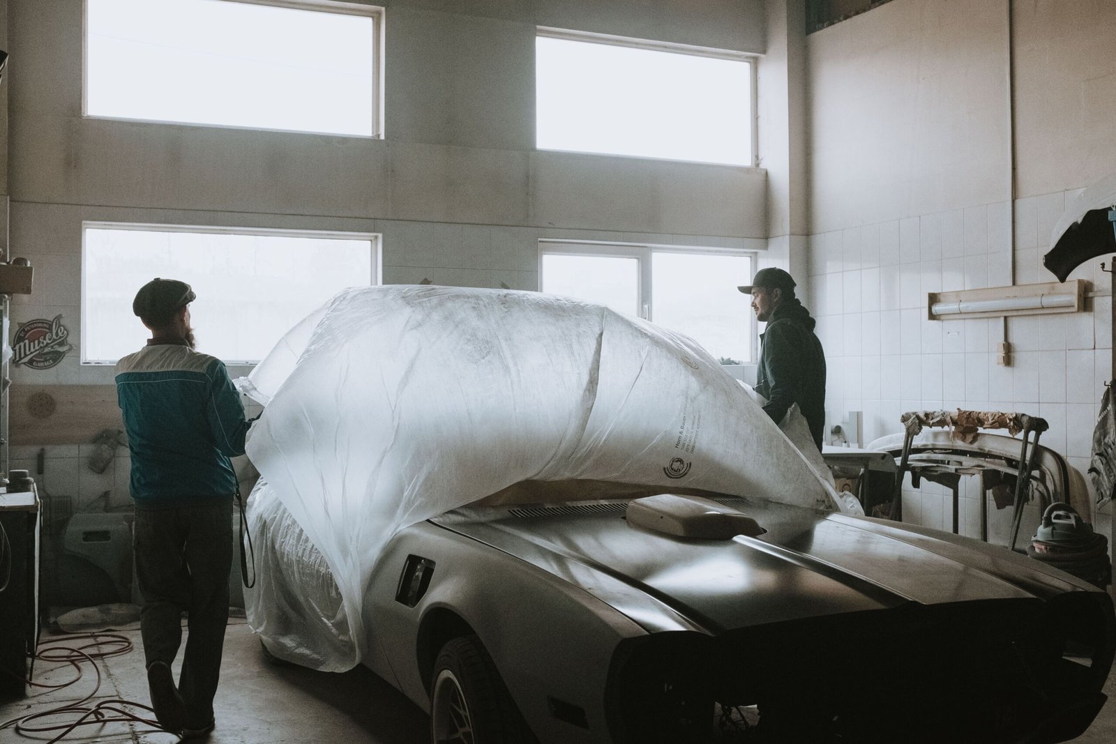 mechanic repairing car body garage workshop